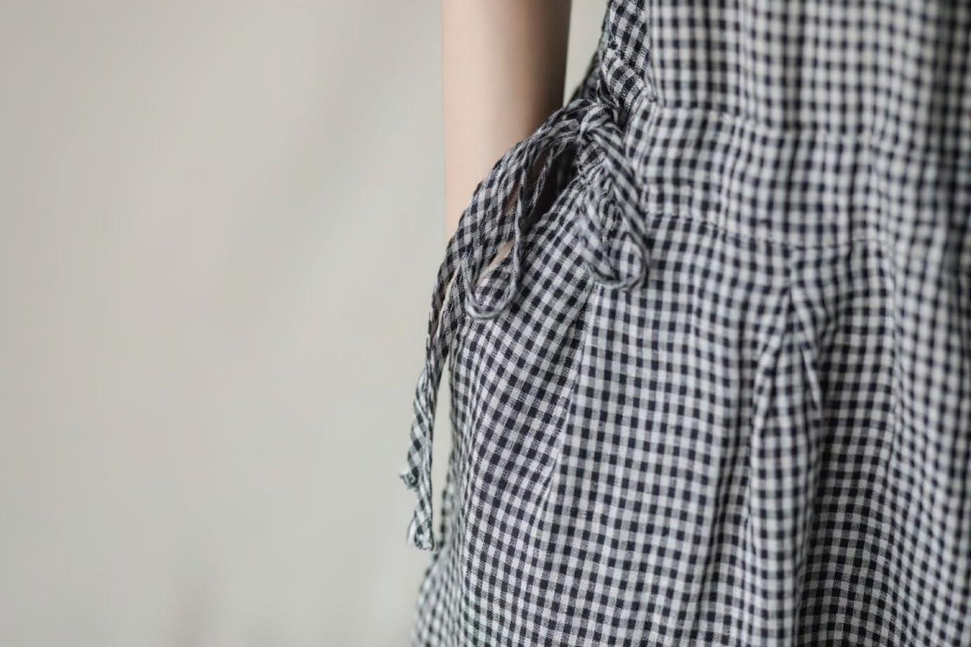 imagechouyatou Womens Plaid Button Up Wide Leg Romper Pants Loose Fit Short Sleeve Long Jumpsuit Overalls with PocketsBlack
