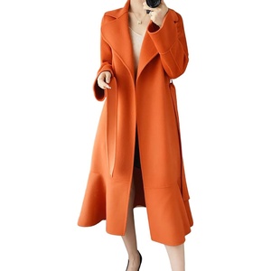 image:imagechouyatou Womens Winter Wool Trench Coat Flare Fishtail Hem Loose Fit Warm Mid Long Overcoat with BeltOrange
