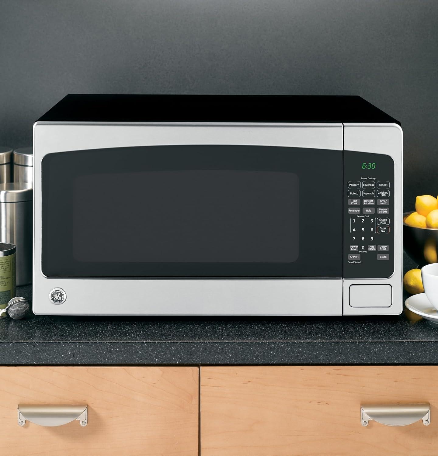 imageGE Countertop Microwave Oven 1200watt Capacity 20 Cubic Ft 8 Auto Setting Cooking Settings ChildLock Technology Kitchen Essentials for the Countertop Dorm Room or Apartment Satinless SteelStainless Steel