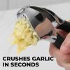 imageZulay Comfort Grip Garlic Press  Garlic Mincer Tool  Garlic Crusher  Garlic Press Mincer Rust Proof with Soft Ergonomic Handle Easy Clean Set with Peeler and BrushCharcoal Black