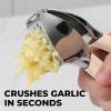 imageZulay Comfort Grip Garlic Press  Garlic Mincer Tool  Garlic Crusher  Garlic Press Mincer Rust Proof with Soft Ergonomic Handle Easy Clean Set with Peeler and BrushPetal Pink