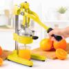 imageZulay Kitchen CastIron Orange Juice Squeezer  HeavyDuty EasytoClean Professional Citrus Juicer  Durable Stainless Steel Lemon Squeezer  Manual Citrus Press ampamp Orange Squeezer Light GreenBright Yellow