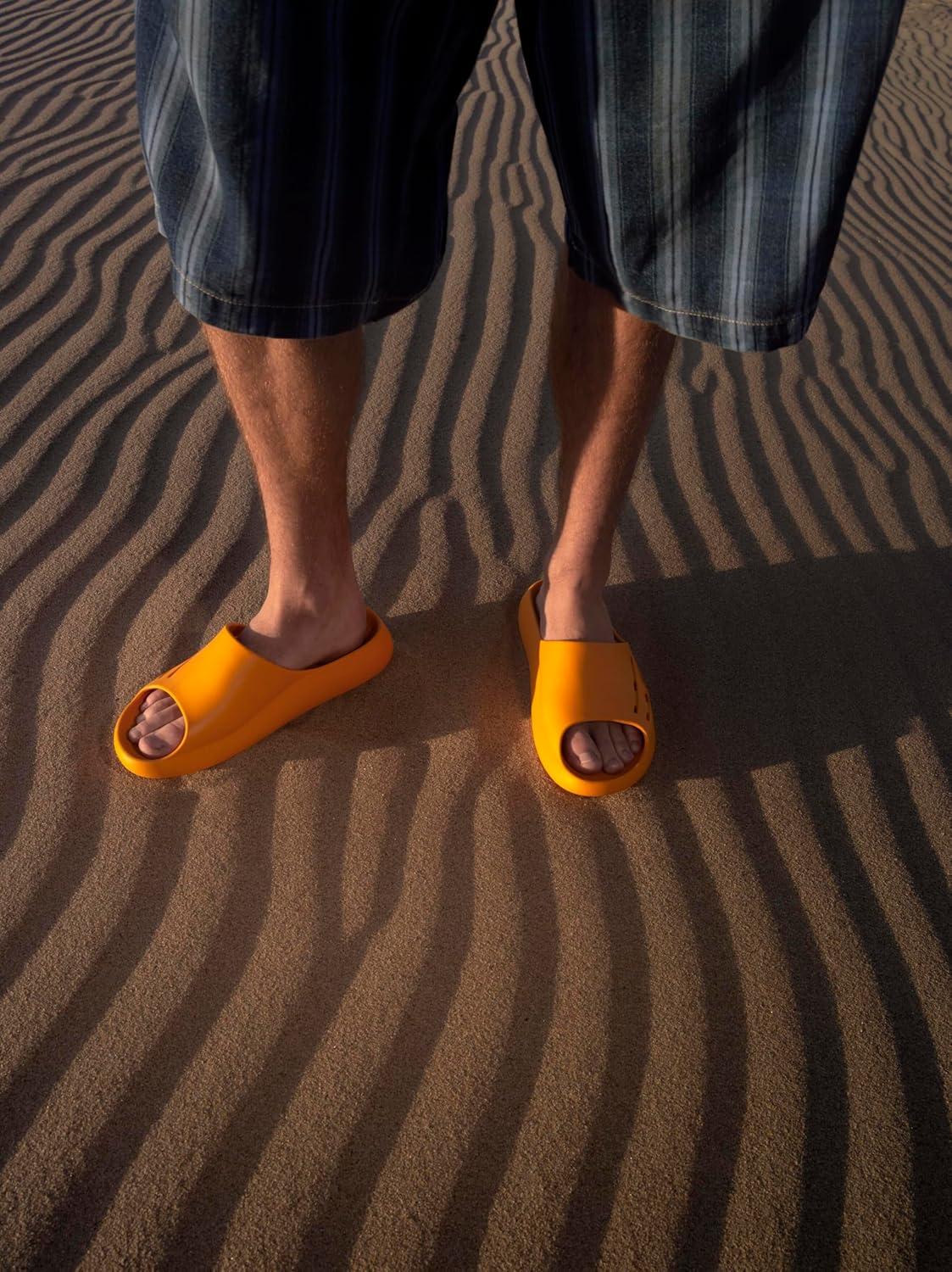 imageECCO UnisexAdult Cozmo Perforated Slide SandalSunrise