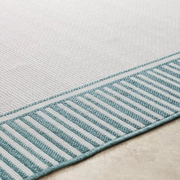 Artistic Weavers Hampshire Solid Border Outdoor Area Rug 73 Square Taupe25 x 1110 TealWhite