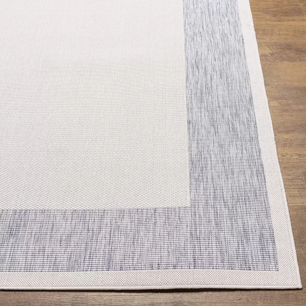 Artistic Weavers Sawyer Outdoor Border Modern Area Rug 53 x 7 CreamBlueArtistic Weavers Sawyer Outdoor Border Modern Area Rug 53 x 7 CreamBlue