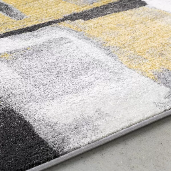 Malachi Black and Gray Modern Area Rug 711 x 10711 x 10 Mustard