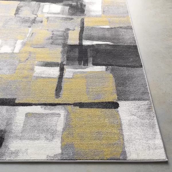 Malachi Black and Gray Modern Area Rug 711 x 10711 x 10 Mustard