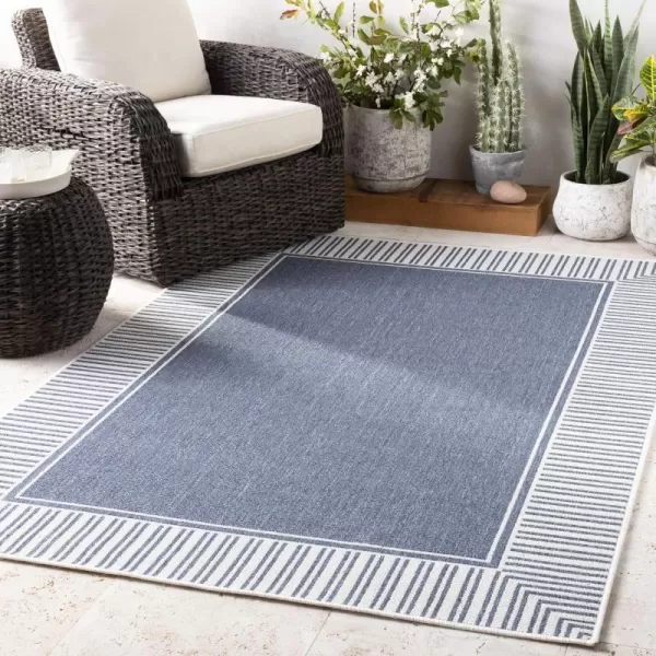 Artistic Weavers Hampshire Solid Border Outdoor Area Rug 73 Square Taupe25 x 45 Denim