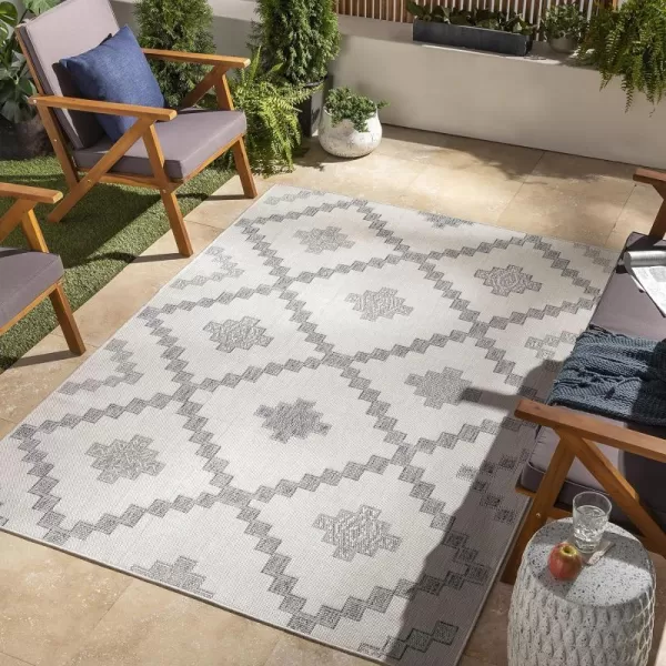 Artistic Weavers Sawyer Rustic Tribal Diamond Outdoor Area Rug 53 x 7 CreamBlueArtistic Weavers Sawyer Rustic Tribal Diamond Outdoor Area Rug 53 x 7 CreamBlue