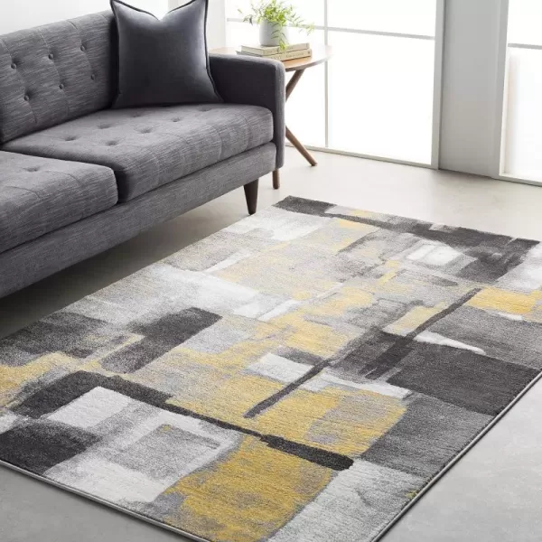 Malachi Black and Gray Modern Area Rug 711 x 10711 x 10 Mustard