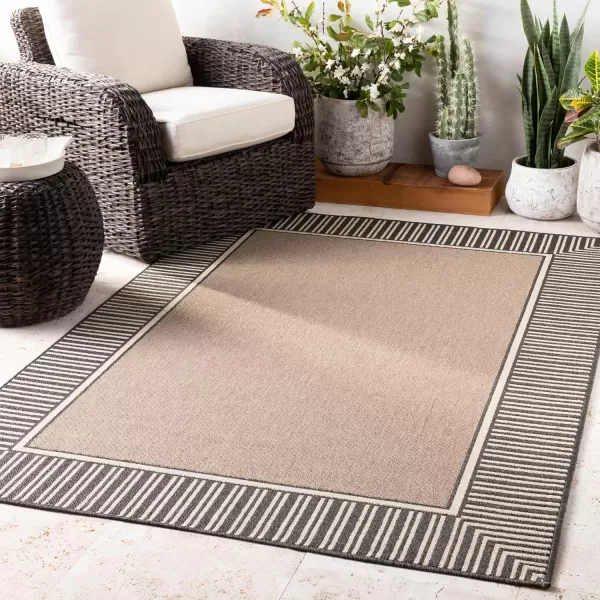 imageLivabliss Hampshire Solid Border Outdoor Area Rug 53quot x 77quot BlackBlackCamel