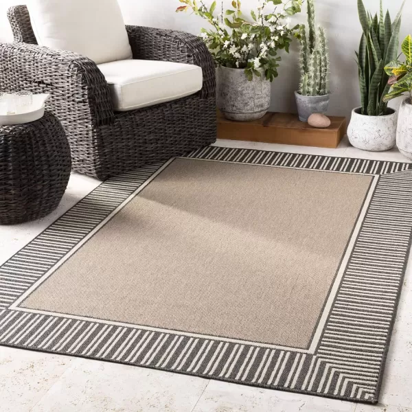 imageLivabliss Hampshire Solid Border Outdoor Area Rug 53quot x 77quot BlackBrown