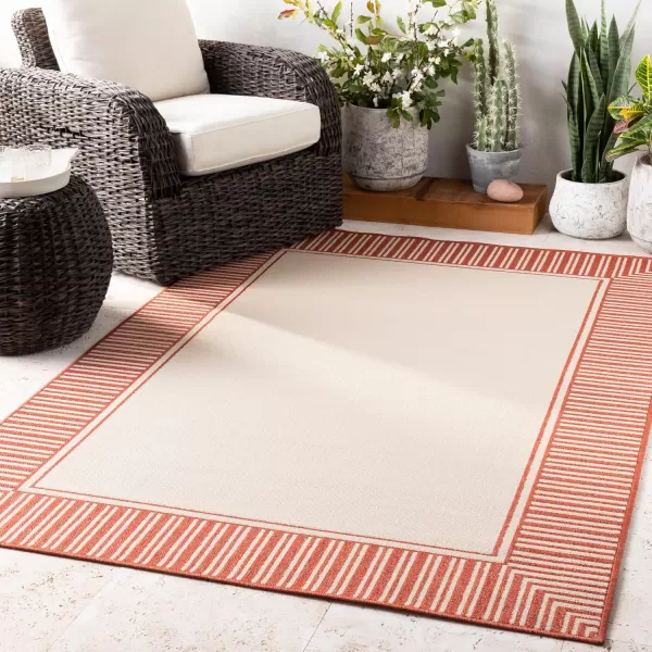 imageLivabliss Hampshire Solid Border Outdoor Area Rug 53quot x 77quot BlackOrange