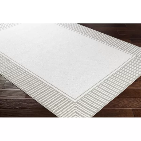 imageLivabliss Hampshire Solid Border Outdoor Area Rug 53quot x 77quot BlackTaupeWhite