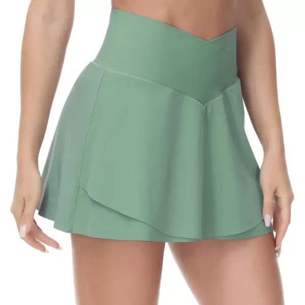 imageTHE GYM PEOPLE Womens Cross Waist Tennis Skirts with Cutting Hem Golf Skorts with Inner Mesh Pockets ShortsJasmine Green