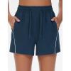 imageTHE GYM PEOPLE Womens High Waist Running Shorts with Pockets Loose Fit Lightweight Workout Yoga Athletic TracksBlue