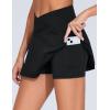 imageTHE GYM PEOPLE Womens Cross Waist Jean Skorts Stretchy Ruffle Denim Skirts with 2 in 1 Shorts PocketsBlack