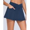 imageTHE GYM PEOPLE Womens Cross Waist Jean Skorts Stretchy Ruffle Denim Skirts with 2 in 1 Shorts PocketsDark Blue